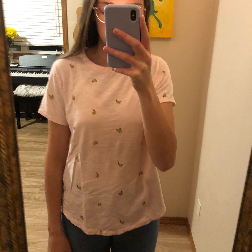 Light pink tshirt with bananas on it.